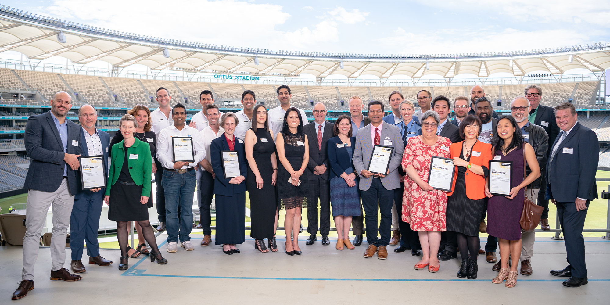 A group of people at Optus stadium with Curtinnovation Awards