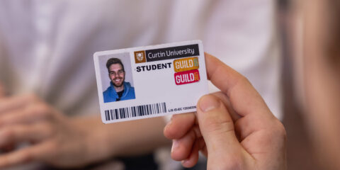 Someone holding a student ID