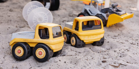 Toy trucks in sand