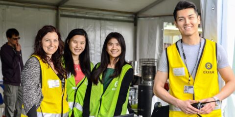 students with high-vis vests working at a construction site