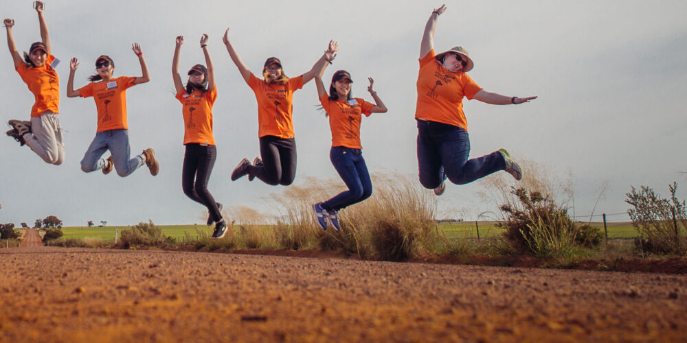 Six people jumping at the same time in the Australian outback