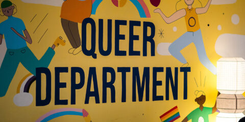 Photo of wall that says Queer Department