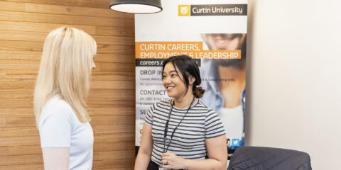 student talking to curtin careers representative