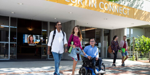 Three students walk out of Curtin Connect.