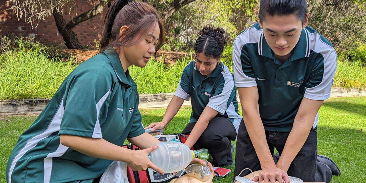 Paramedicine student loading St John Ambulance