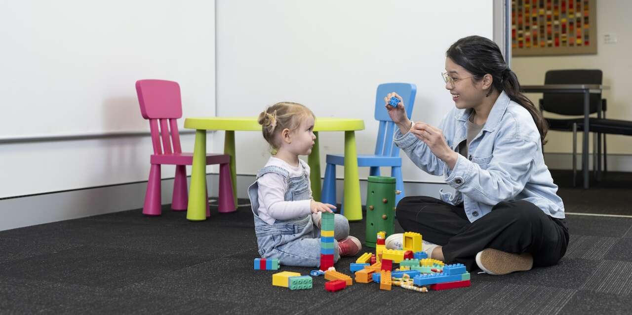 Speech Path student in consultation with child