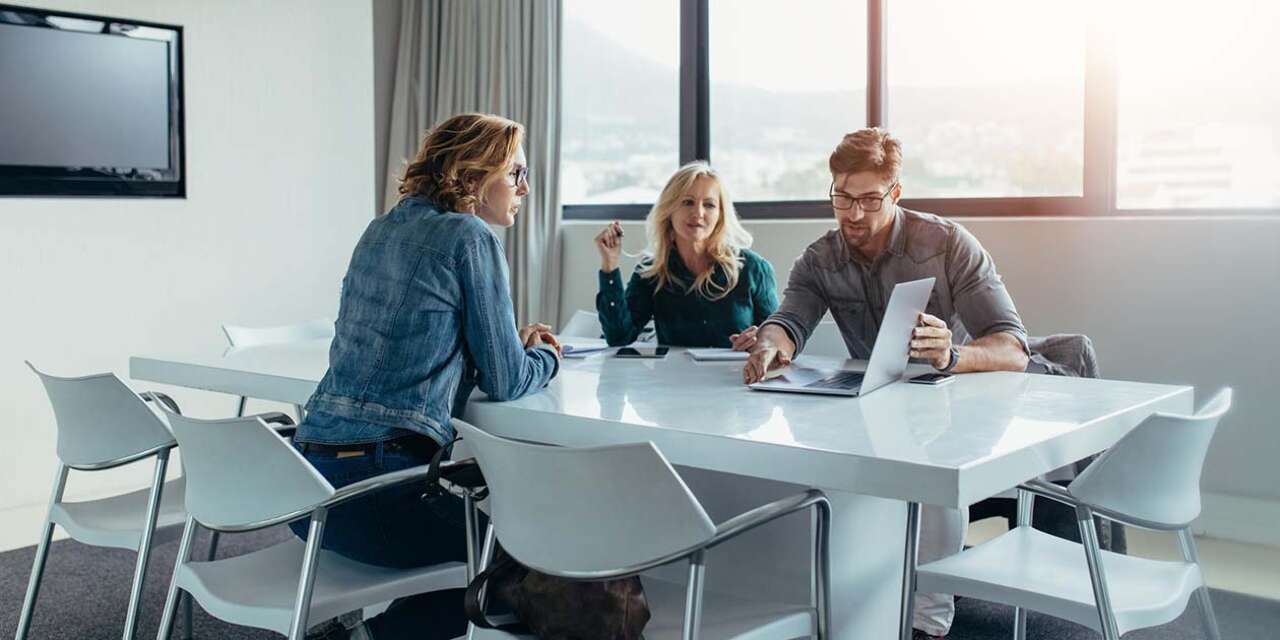 Group of people around a table in a business setting