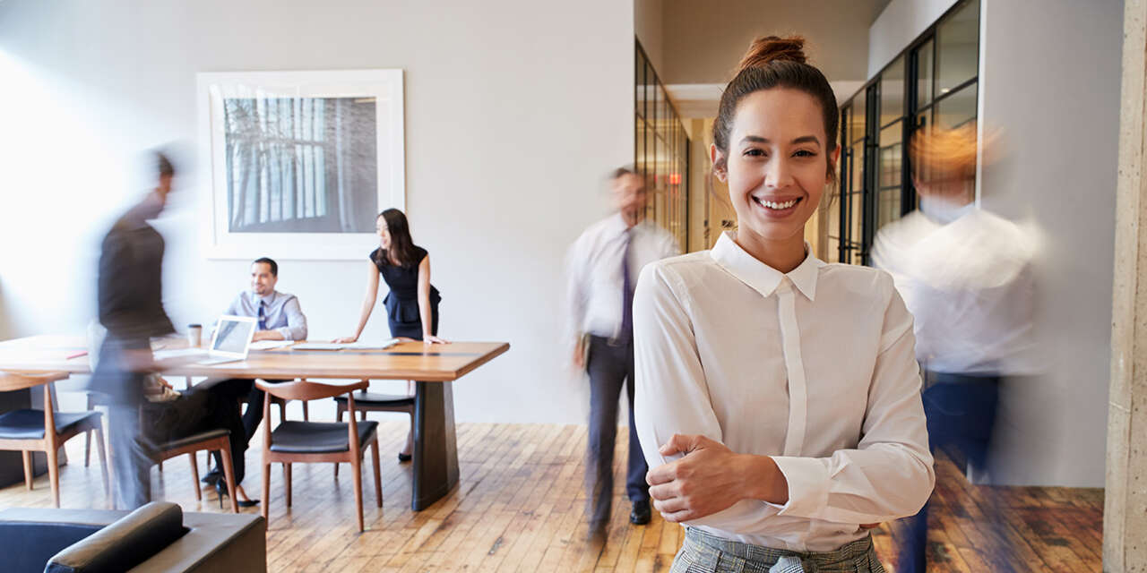 Young business woman standing in a meeting room