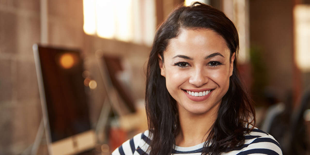 A student smiling at the camera