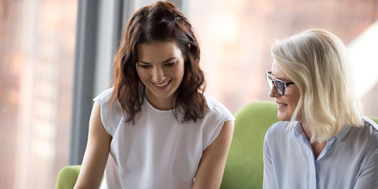 Two business women talking