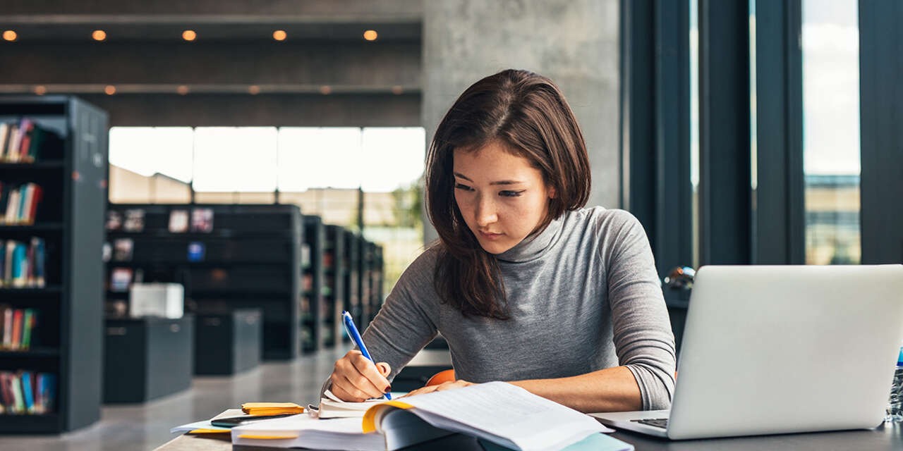 Student studying in a library