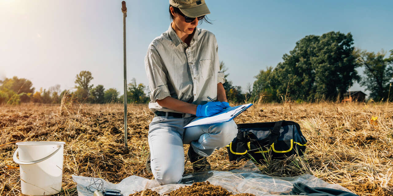 Earth scientist making notes