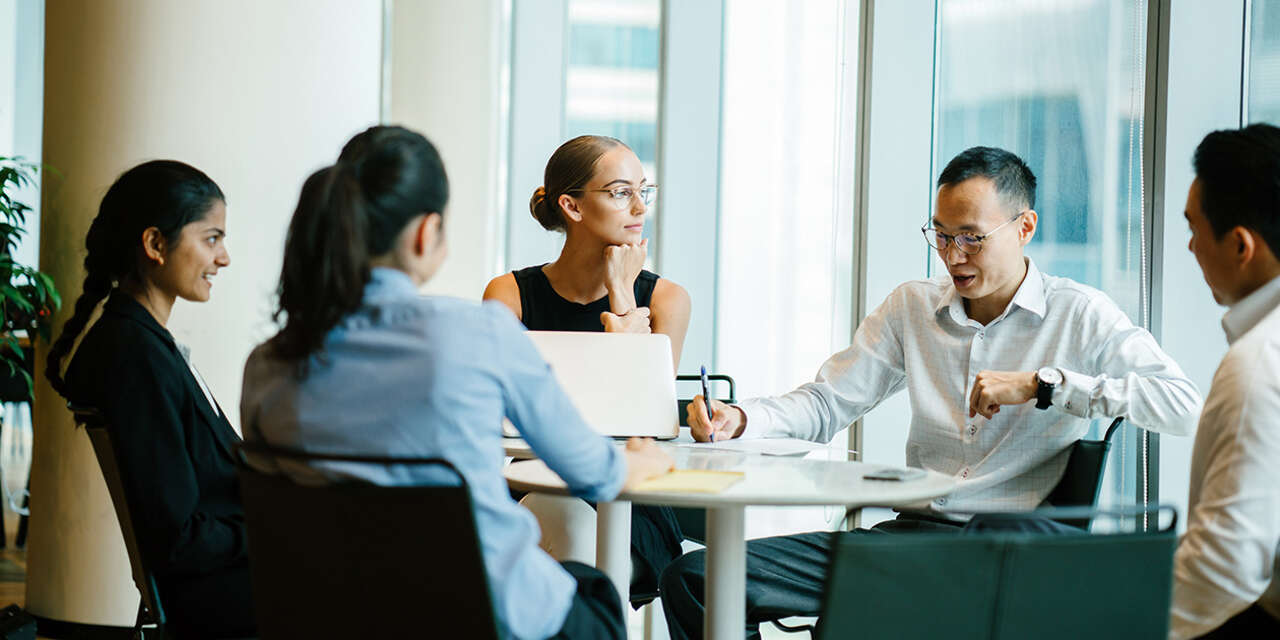 Students in a meeting with their mentor