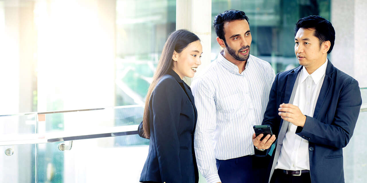 Three business people chatting