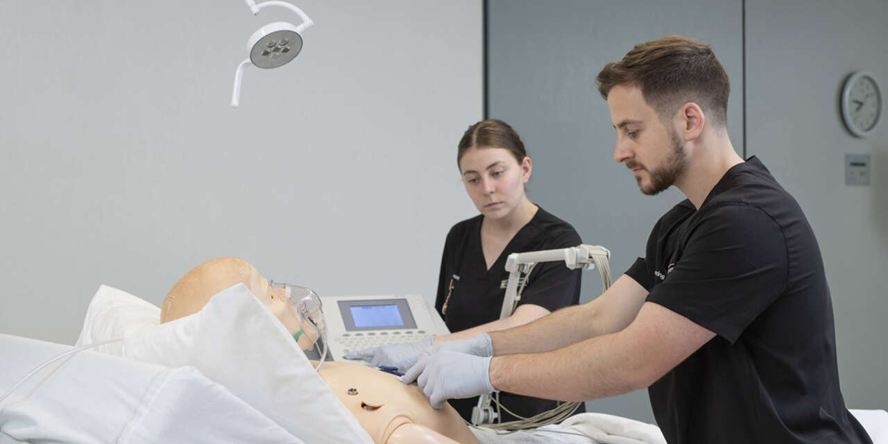 Nursing students with patient