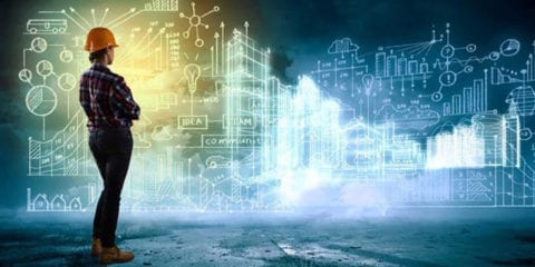 Female engineer overlooking a series of graphs