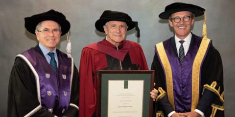 Kerry Stokes standing with honorary Doctorate of Science awarded by Curtin.