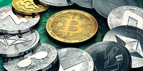Huge stack of cryptocurrencies in a circle with a golden bitcoin in the middle.